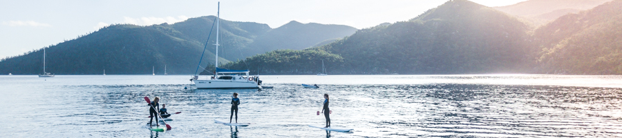 Paddleboarding on Whitsunday Adventurer