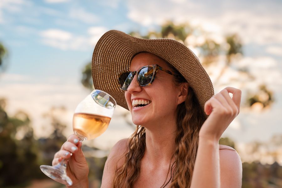 https://images.thetravelshop.com/img/3128/gallery/woman-wine-glass-laughing.jpg Main Image | East Coast Tours Australia