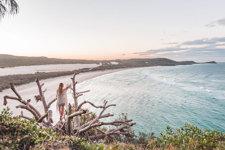 girl standing on a cliff overlooking kgari beaches