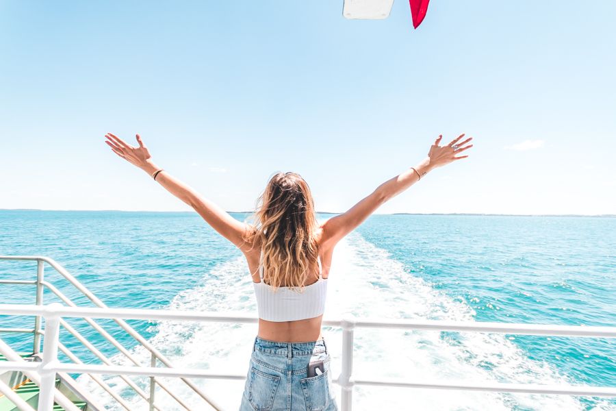 girl on the ferry cruising over to kgari fraser island