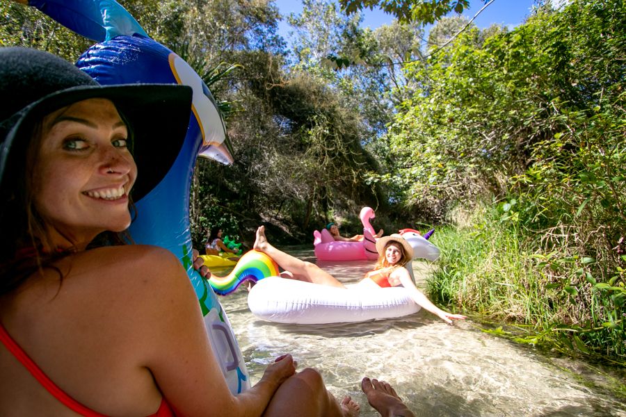travellers on floats in eli creek on kgari fraser island