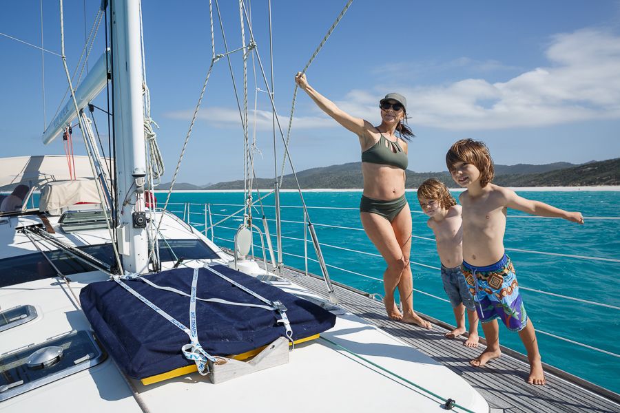 Sailing the Whitsundays Family family standing on a sailboat in the whitsundays