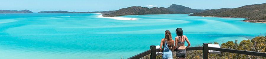 A lookout that looks over white sand and blue water
