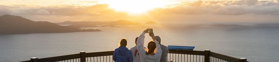 Hamilton Island Views people overlooking the whitsunday islands and sunrise