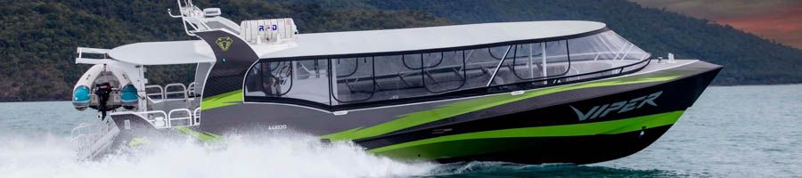 A black and green boat on the Great Barrier Reef