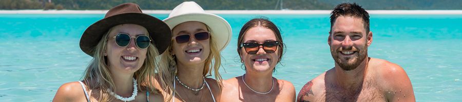 A group of friends in the waters of Whitehaven Beach