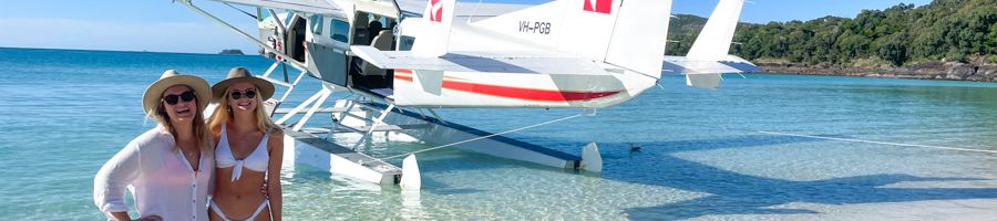 Seaplane Two women on Whitehaven with seaplane