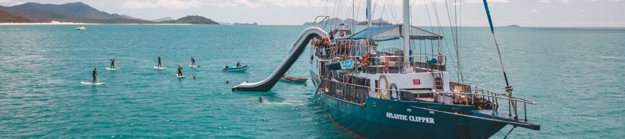 Atlantic Clipper Whitsundays Boat with waterslide, SUPs and calm conditions