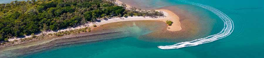 K'gari Salty Safari Western Wonder Tour boat sailing around headland