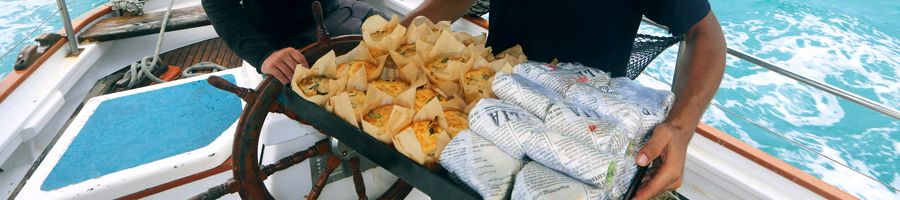 Tray of muffins and wraps held by a hosty 