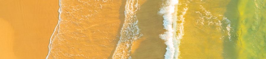 waves washing onto the shore on k'gari