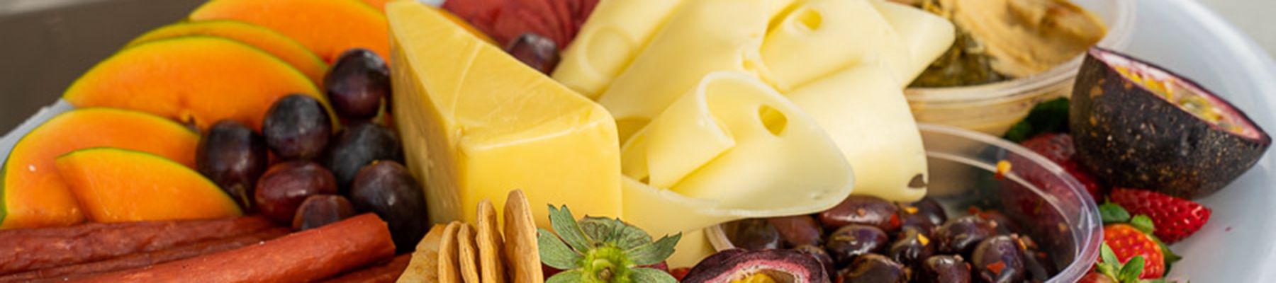 Antipasto with cheese, crackers, dips and fruit