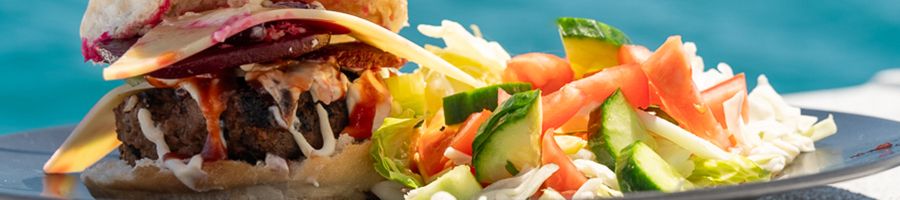 Clipper Sample Menu A salad plate with a burger
