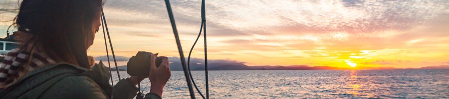 Providence V Sunset Sail, Sailing Whitsundays Person taking a photo of the sunset, Providence V Sunset Sail