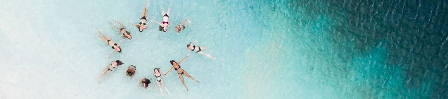 A group of people swimming in Lake Mazkenzie