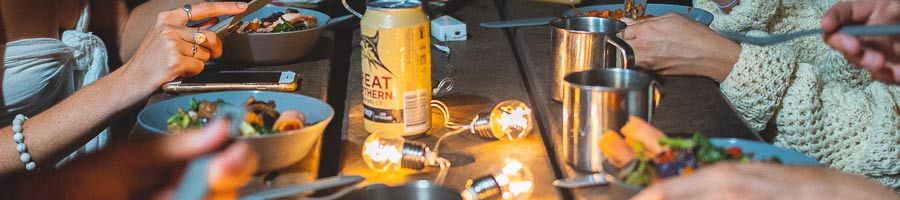 K'gari Camping close up of people eating dinner at a campsite