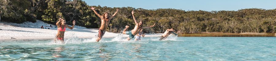 Jumping into Lake Mckenzie