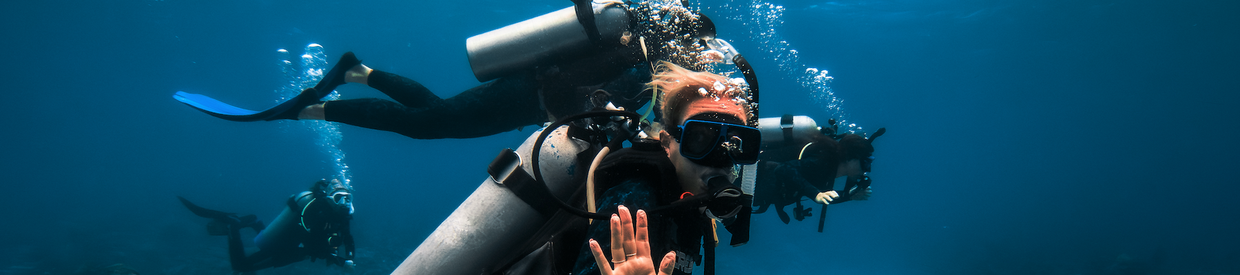 a woman scuba diving on the great barrier reef