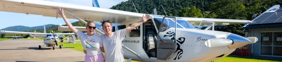 Ocean Rafting's Scenic Flight A man and woman standing in front of a scenic flight