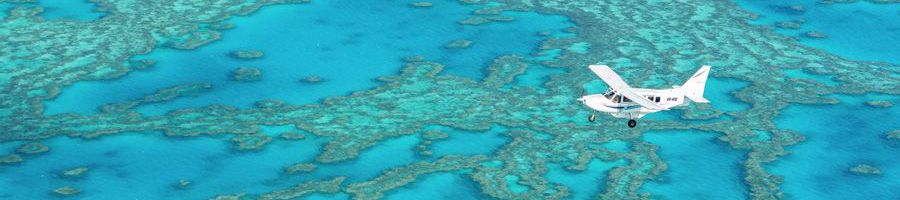 Ocean Rafting Scenic Flight Seaplane flying over the Great Barrier Reef