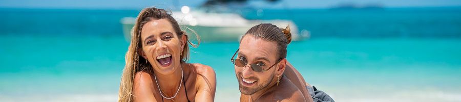 Two young people on Whitehaven Beach 