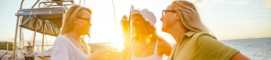 Atlantic Clipper, Whitsundays A group of backpackers on a boat at sunset