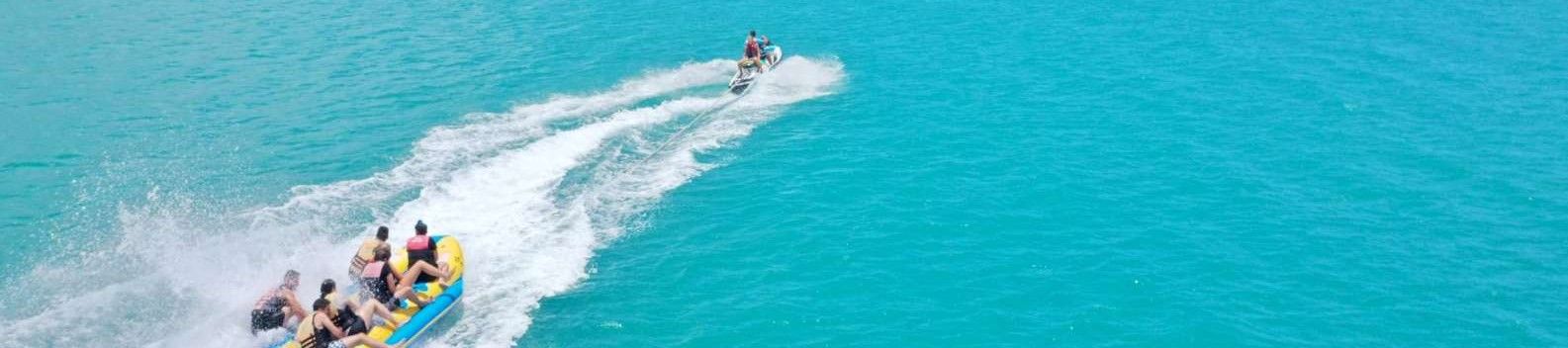 Banana Boat making waves on blue water