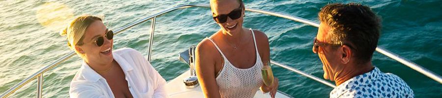 Afternoon Salty Charter travellers relaxing on salty with drinks at sunset