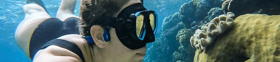 Saxon Reef girl snorkelling up close to unique corals at saxon reef