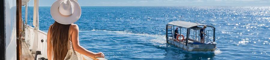 Reef Encounter woman looking out at the glass bottom boat on reef encounter