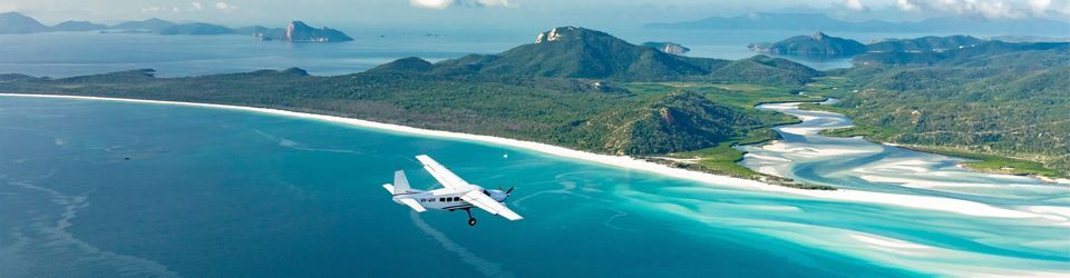 Scenic Flight Whitsundays Ocean Rafting seaplane flying over Whitsunday Island