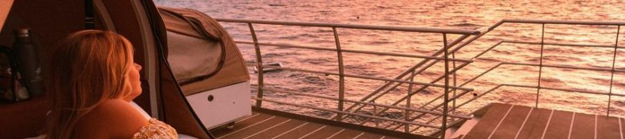 Reefsleep girl looking at sunrise on the reef