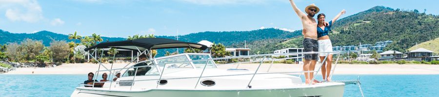 Salty Yacht couple posing on salty yacht in airlie beach