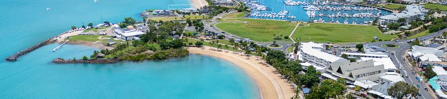 Airlie Beach aerial view of downtown airlie beach and nearby blue water