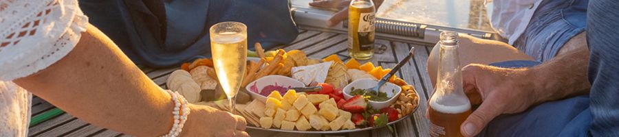 MiLady Sunset Charter Snacks cheese board and drinks spread on milady sunset charter