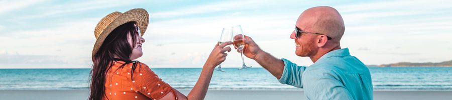 Beach picnic Domino Couple with champagne on a beach picnic