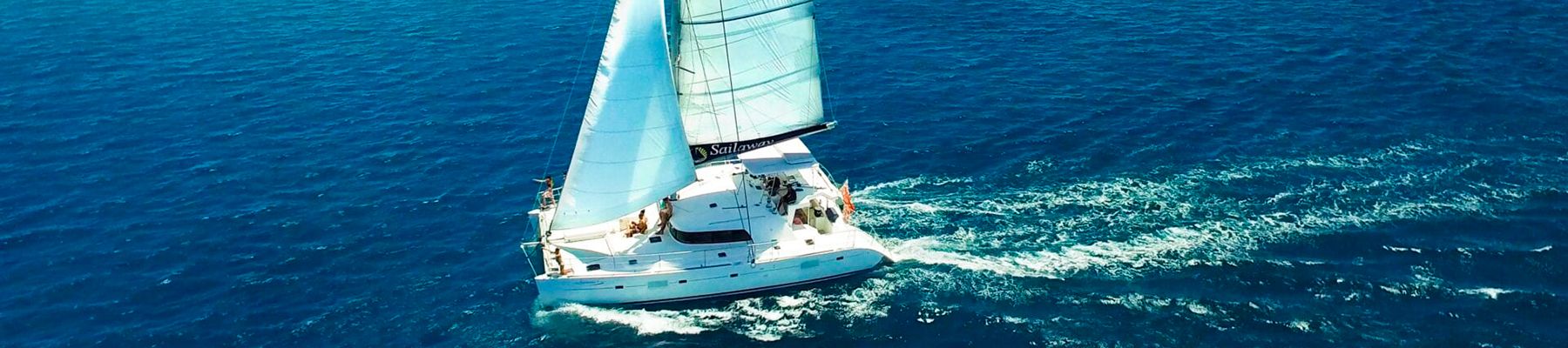 Sailing Catamaran in Cairns over the Reef