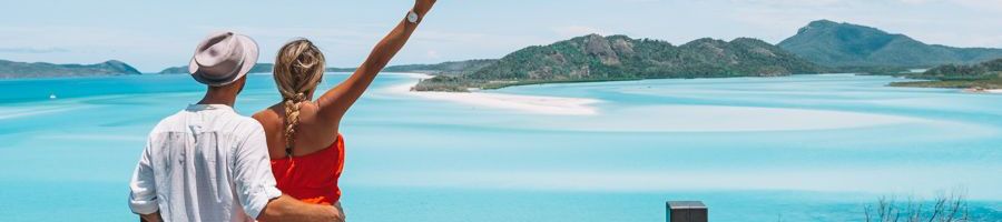 Hill Inlet Lookout< Whitsundays Couple at Hill Inlet Lookout gazing at the swirling sands