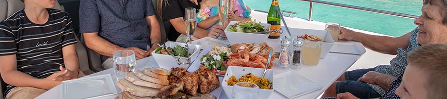 Food Axopar 37 Food on axopar at the table, salads, meats and wine