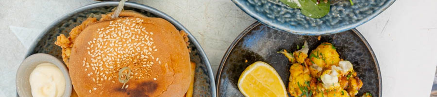 Burger and chips, with salad on a plate