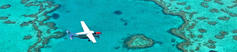 Great Barrier Reef Scenic flight flying over turqouise reefs