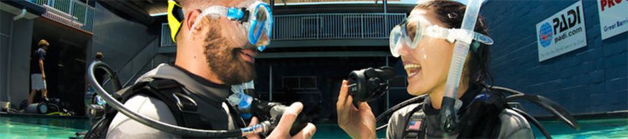 Two people learning how to dive at the Pro Dive Cairns training centre