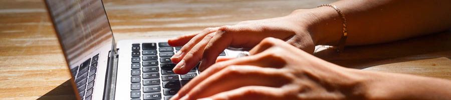 Person typing on a laptop