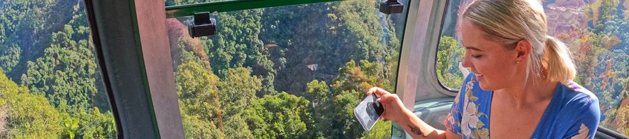 Woman taking a photo in the skyrail