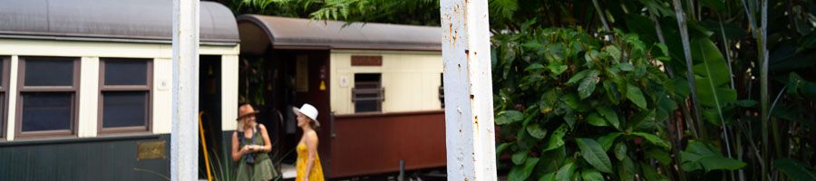 Girls boarding Kuranda Scenic Railway carriage