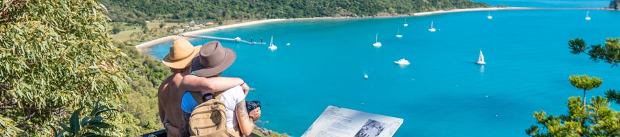 Two people gazing over the water from Spion Kop lookout Two people gazing over the water from Spion Kop lookout
