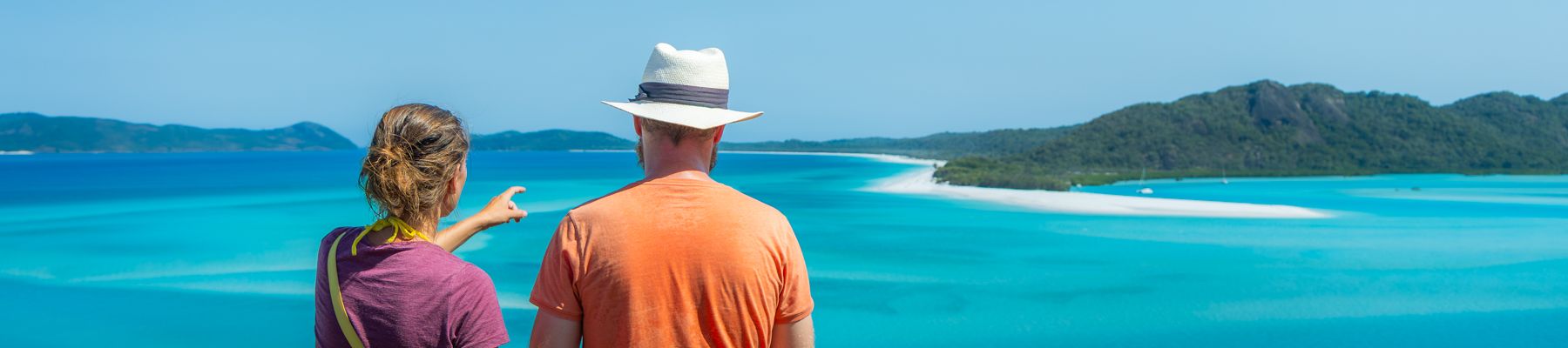 Hill Inlet Lookout a couple standing at hill inlet lookout overlooking whitehaven beach