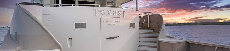 Texas T, Whitsundays Texas T Superyacht at sunset with timber decking and white finishes