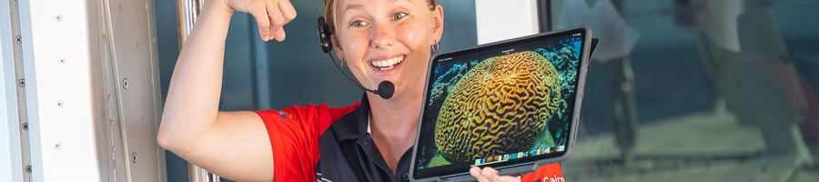 woman giving presentation about coral on the reef