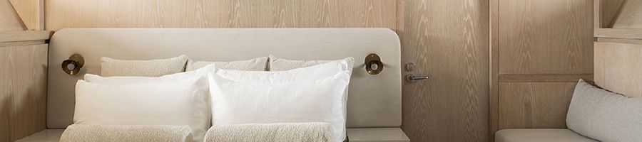 AKIKO Superyacht bedroom crisp neutral colored bedroom on a superyacht
